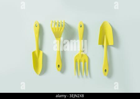Various gardening Hand tools on blue background. Top view. Stock Photo