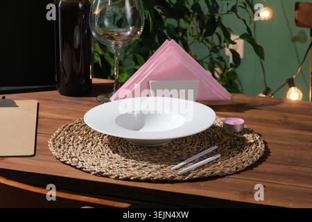 Beautifully set table in a fine dining restaurant, ready for a special event or elegant dinner Stock Photo