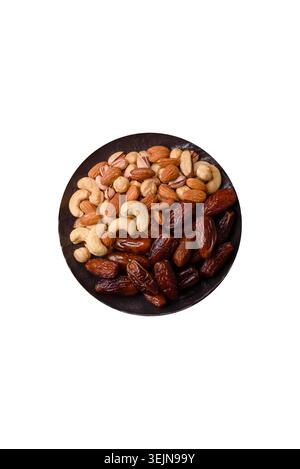 Dried dates on a ceramic plate for Ramadan or Iftar. Dates fruit as a background Stock Photo