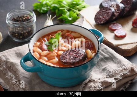 Spanish fabada on brown table. Copy space Stock Photo
