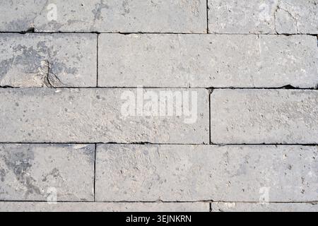 Light Gray Limestone Brick Wall Background with Natural Stone Texture. Stock Photo