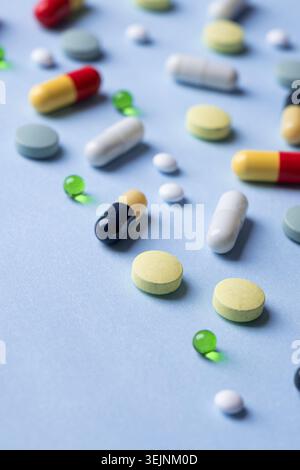 Different pills on color background, flat lay Stock Photo