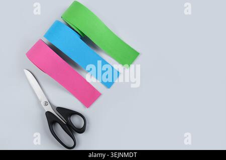 Three rolls kinesiology tape on blue background. Stock Photo