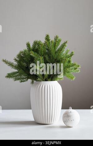 Minimalist creative Christmas tree made of fir branches Stock Photo