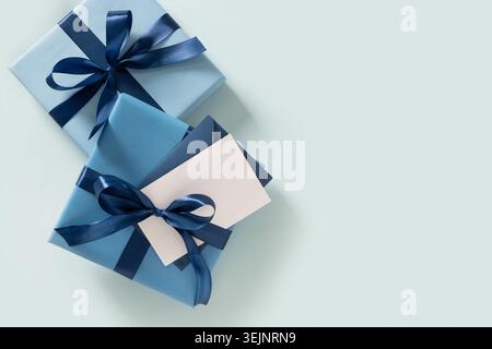 Happy Fathers Day gift box and empty blank for letter on blue. Stock Photo