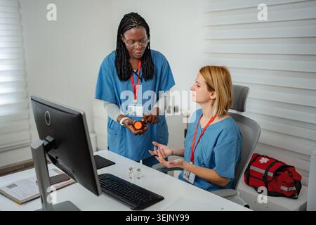 Healthcare professionals analyzing medication, collaborating and providing medical advice Stock Photo