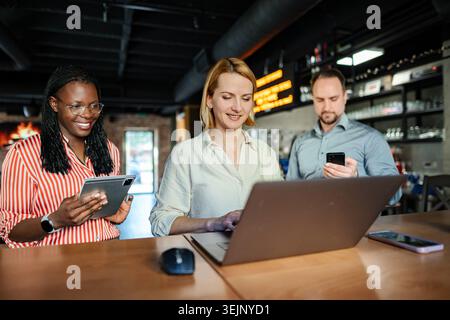 Diverse business professionals collaborating remotely using technology Stock Photo