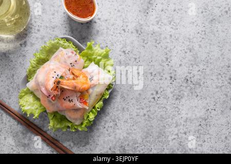 Spring rolls with prawn, noodles and vegetables in rice paper. Asian cuisine. Stock Photo