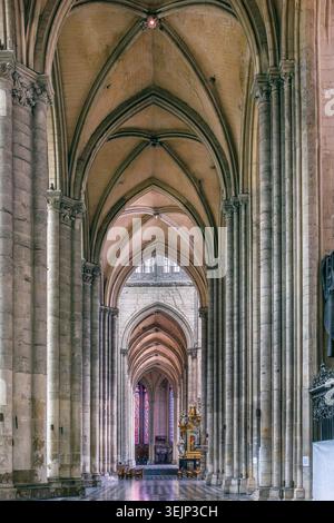 Transept of Amiens Cathedral, France, low angle view. High gothic stone pillars and vaulted ceiling in cathedral interior Stock Photo
