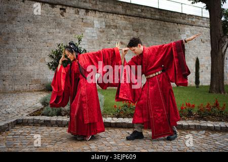 Happy diverse couple playfully dancing during wedding ceremony Stock Photo