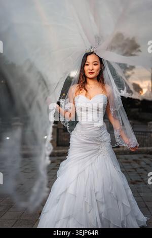 Chinese bride wearing wedding dress and veil for wedding Stock Photo