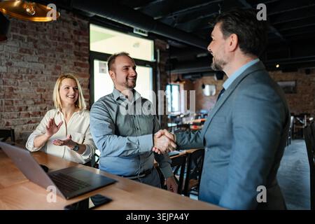 Business partners shaking hands making a deal Stock Photo