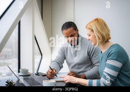 Business people collaborating on project in modern office Stock Photo