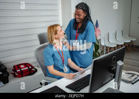 Nurses collaborating in modern hospital office Stock Photo