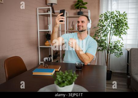 Man learning sign language during video call communication Stock Photo