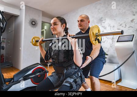 Empowered workout session with support and strength training Stock Photo