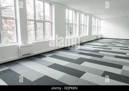 Empty office space With Checkered Floor and Windows Stock Photo