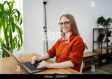 Professional woman working from home in a stylish modern office Stock Photo