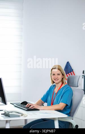 Female medical professional working on computer in office Stock Photo