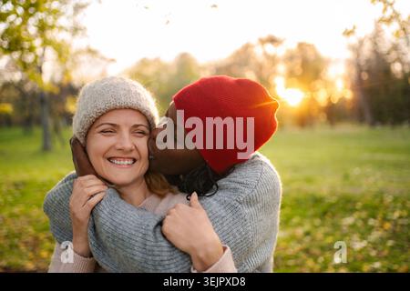 Diverse women showing affection from different generations Stock Photo