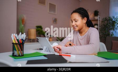 Girl student learning education using digital tablet at home Stock Photo