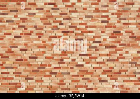 Brick wall texture in warm tones. Exterior view. New beige building. Stock Photo