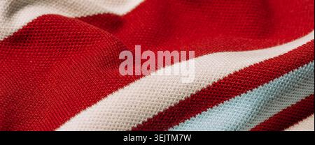 Red striped fabric with soft texture and folds Stock Photo