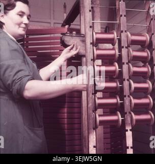 Weaving velvet for the coronation robe, Braintree, Essex, c1953. 'Mrs Whitehead spinning bobbins.' Warner &amp; Sons, who had more than 50 years' experience producing textiles for coronation ceremonies, supplied the fabrics for the coronation of Queen Elizabeth II on 2 June 1953. Stock Photo