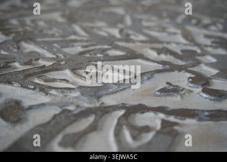 Textured Metallic Silver Melted Liquid Surface Pattern Stock Photo
