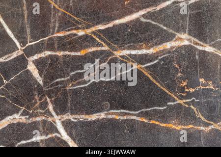 Glossy dark gray marble with white cristal golden veins background material texture Stock Photo