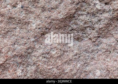 Pink granite stone wall background texture material macro Stock Photo