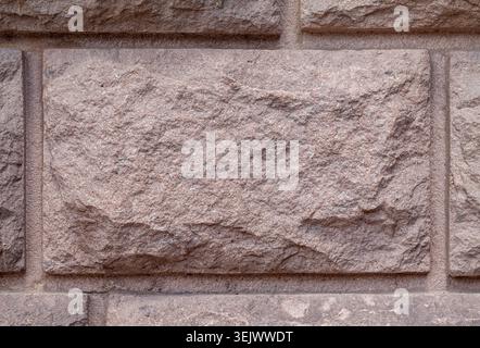 Pink granite stone wall brick background texture material Stock Photo