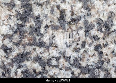 Polished gray and white granite stone cut background material texture Stock Photo