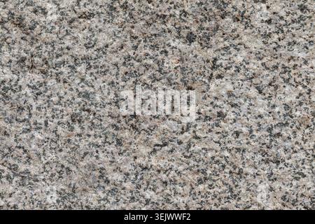 Roughly cut granite stone close up background texture material Stock Photo