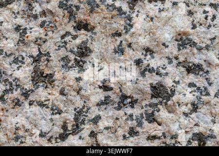 Roughly cut granite stone macro background texture material Stock Photo