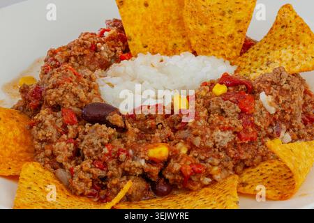 Chili con carne close up with rice and nachos Stock Photo
