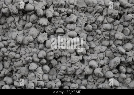 Grayish tones dominate the natural stone patterns. Each stone varies in size and shape. Crisp detail captures the rugged surface quality Stock Photo