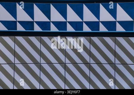 Geometric tile designs on a wall Stock Photo