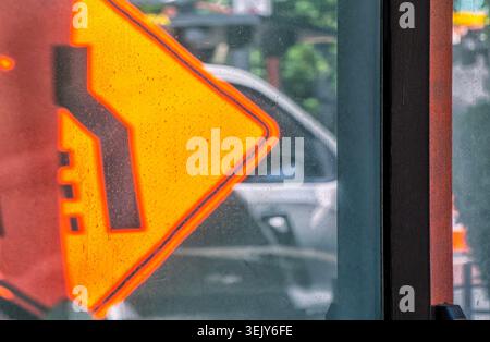 A parked car reflected in an office building window Stock Photo