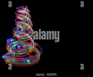 Festive light trails swirl into the shape of a Christmas tree, capturing the magic, colour and motion of the holiday season with black copy space. Stock Photo