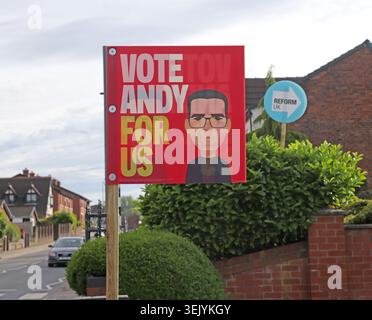 Who is in front? Labour Vote Andy For Us and Reform UK garden signs in Ashton-in-Makerfield during the 2026 Makerfield by-election campaign. Stock Photo