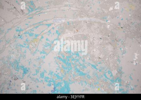 Abstract painted surface with layered textures in pale blue gray and white tones creating an artistic background rich in brushstrokes subtle color var Stock Photo