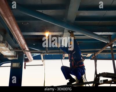 Morowali, Central Sulawesi, Indonesia - January 16, 2026: A worker performs welding work on a steel structure at an industrial facility. Stock Photo