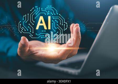 Human hand holds ai technology artificial intelligence robot smart circuit brain over laptop computer, digital innovation empowers future business gro Stock Photo