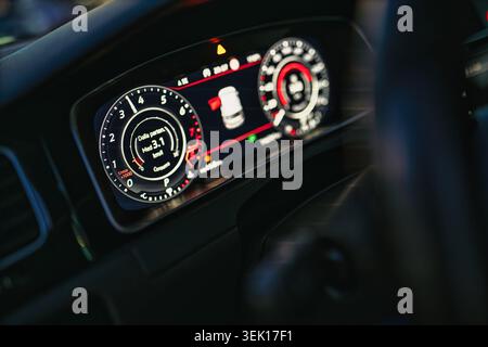 Rome, italy 29 may 2026: modern car dashboard with hi-tech digital instrument cluster displaying speed, rpm, door status and driving data in futuristi Stock Photo