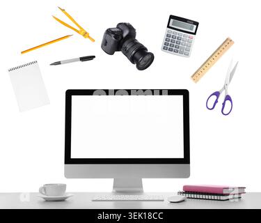 Web design tools flying around computer. Creative designer workspace Stock Photo