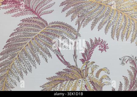 Elegant botanical fern pattern on textured grey cloth fabric Stock Photo