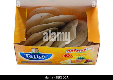 Box of new Tetley Super Fruits Mind exotic fruits helps maintain cognitive function opened to show contents isolated on white teabags tea bags Stock Photo