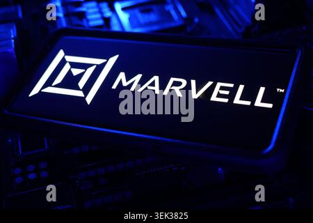 Marvell Logo Displayed On Mobile Phone With Semiconductor Motherboard CPU Chip Background And Advanced Hardware Technology Interface Stock Photo