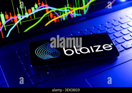 Blaize Logo Displayed On Mobile Phone With Stock Market Performance Chart Background And Trading Graph Interface Stock Photo